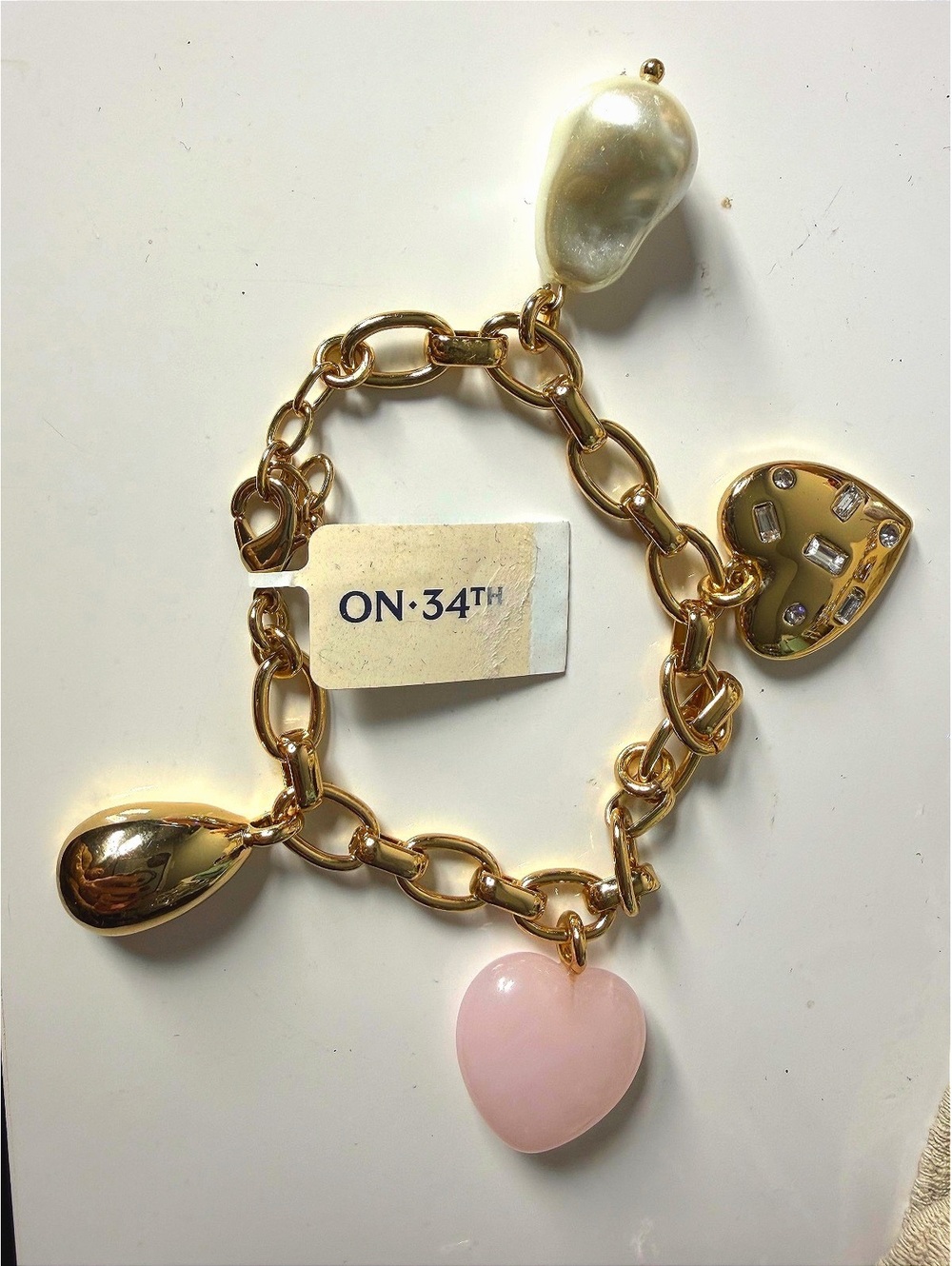 On 34th Gold tone charm bracelet with pink heart BNWT